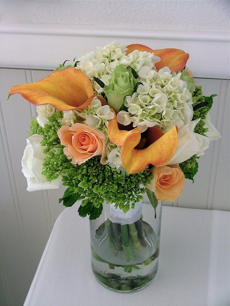 Lush bouquet of roses, hydrangeas and calla lilies arranged by Flower Story