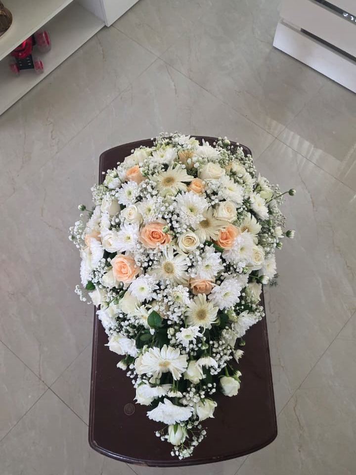 Red and white rose bouquet in a cone wrap